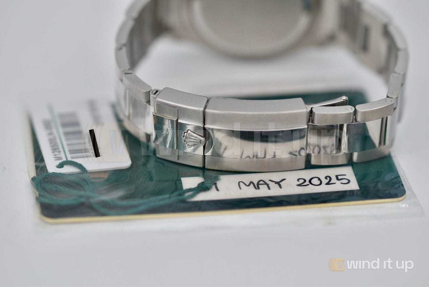 Rolex Daytona 126500LN with its warranty card, from our stock